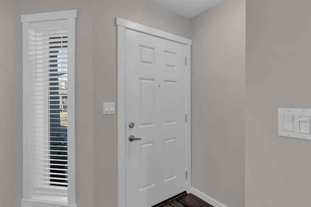 MLS® A2267083 - Unit #108 2400 Ravenswood View SE in Ravenswood Airdrie, Residential