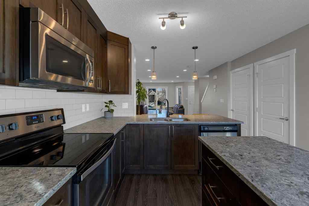 MLS® A2267083 - Unit #108 2400 Ravenswood View SE in Ravenswood Airdrie, Residential