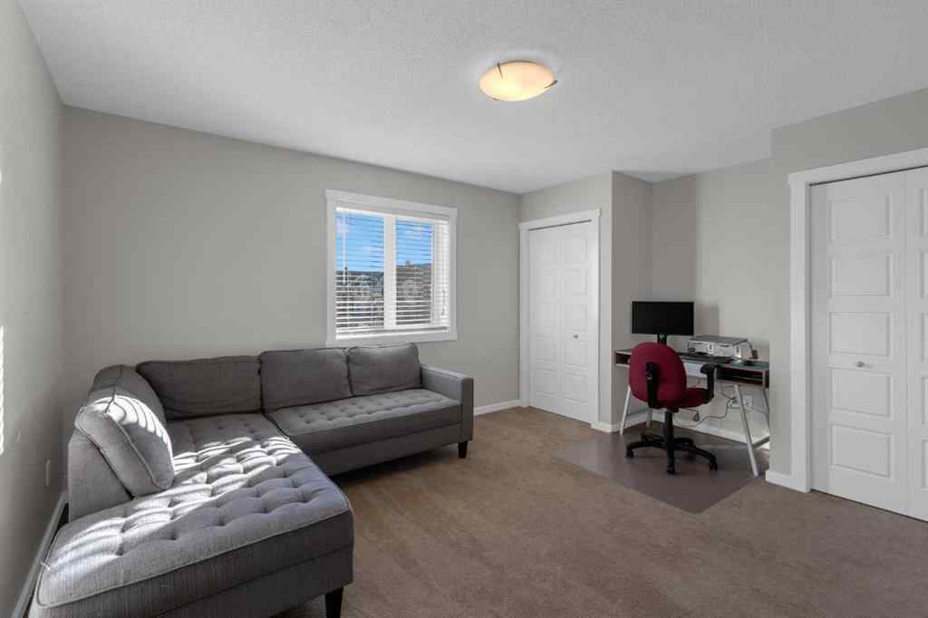 MLS® A2267083 - Unit #108 2400 Ravenswood View SE in Ravenswood Airdrie, Residential