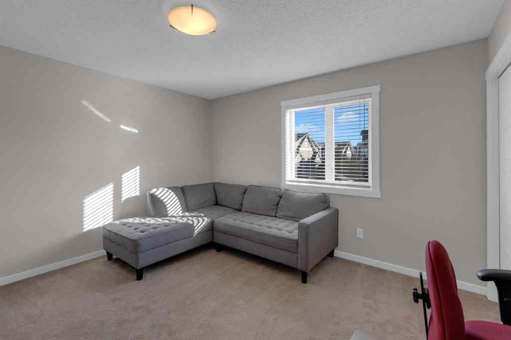 MLS® A2267083 - Unit #108 2400 Ravenswood View SE in Ravenswood Airdrie, Residential