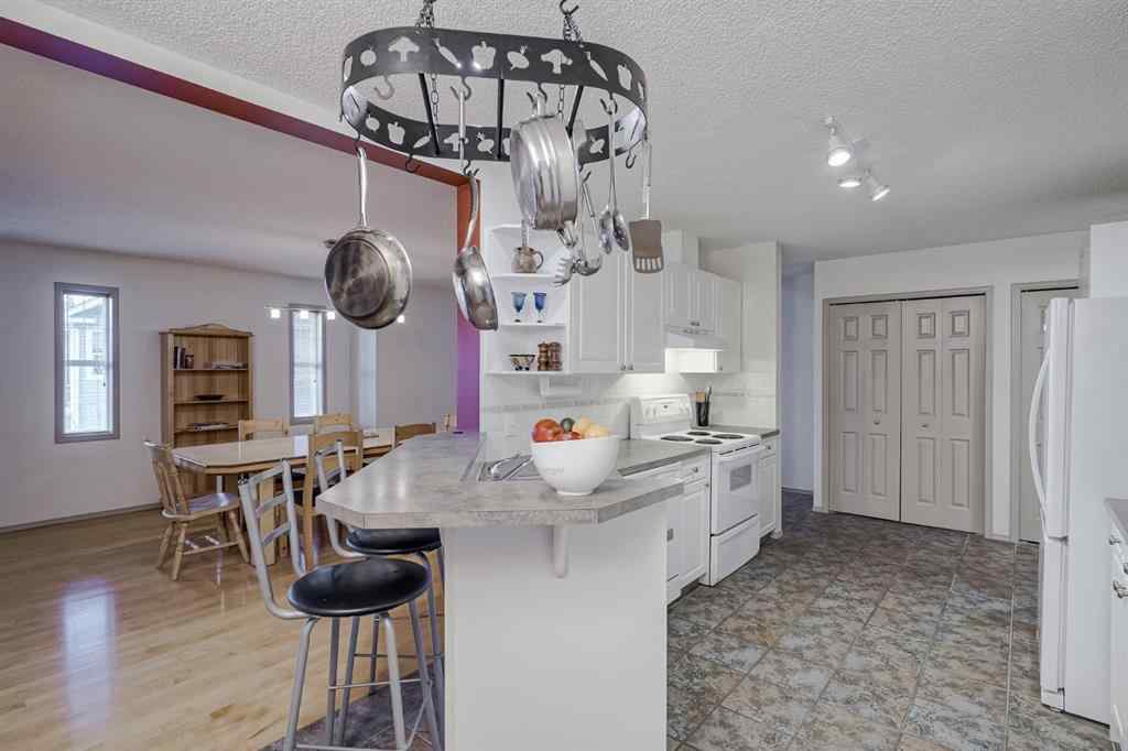 MLS® A2267172 - Unit #104 39 Hidden Creek Place NW in Hidden Valley Calgary, Residential