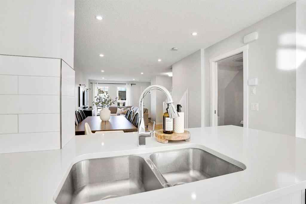 MLS® A2267202 - 128 Cranbrook Square SE in Cranston Calgary, Residential