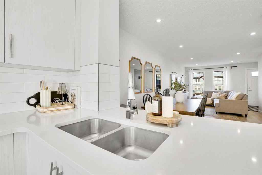 MLS® A2267202 - 128 Cranbrook Square SE in Cranston Calgary, Residential