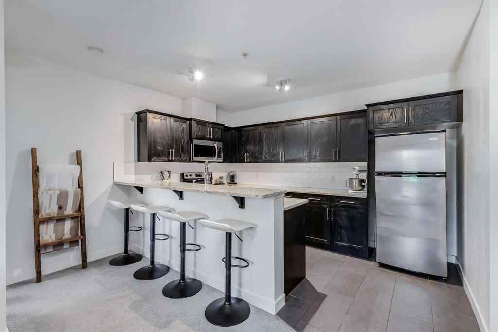 MLS® A2267280 - Unit #204 117 19 Avenue NE in Tuxedo Park Calgary, Residential