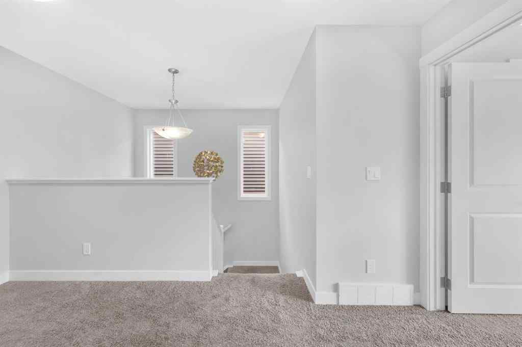 MLS® A2267345 - 149 Belmont Villas SW in Belmont Calgary, Residential