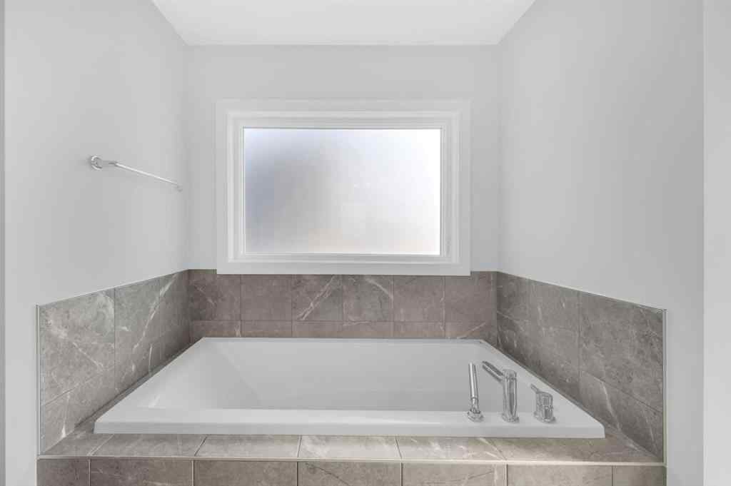 MLS® A2267345 - 149 Belmont Villas SW in Belmont Calgary, Residential