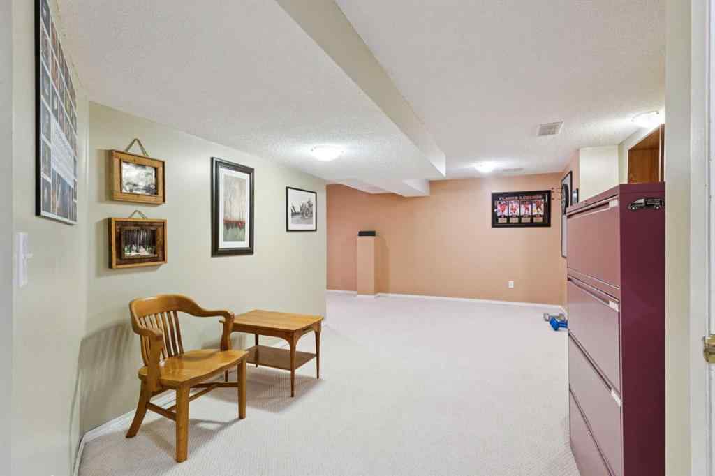 MLS® A2267388 - 15 Millrise Lane SW in Millrise Calgary, Residential