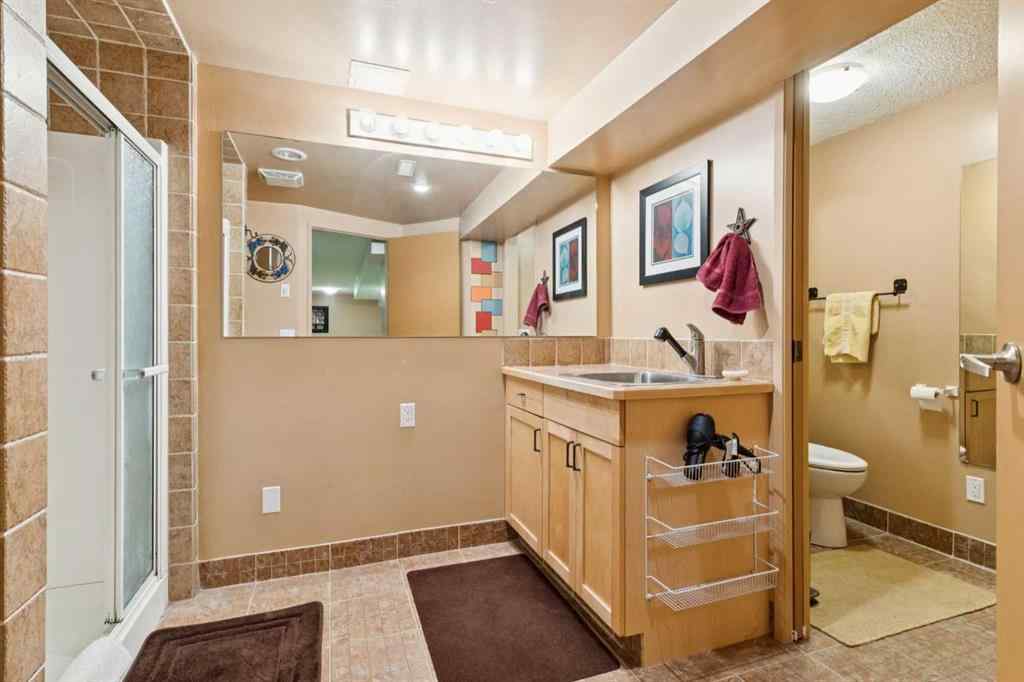 MLS® A2267388 - 15 Millrise Lane SW in Millrise Calgary, Residential