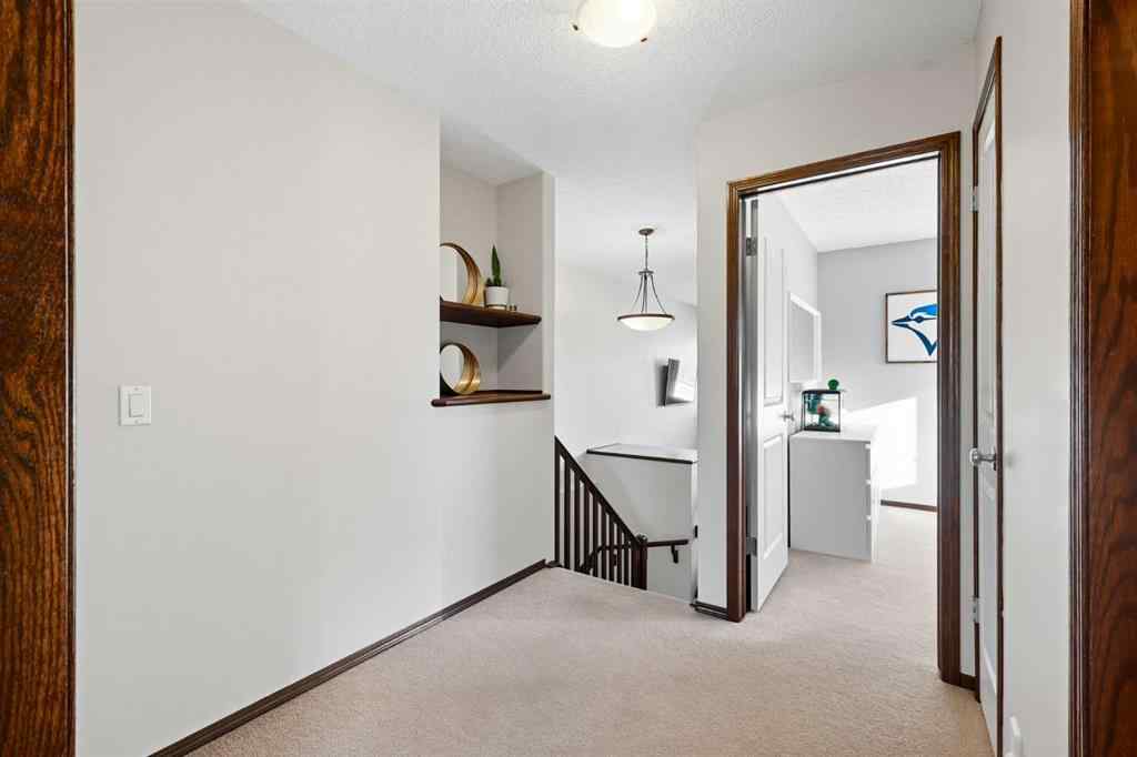 MLS® A2267391 - 155 Sunset Close  in Sunset Ridge Cochrane, Residential