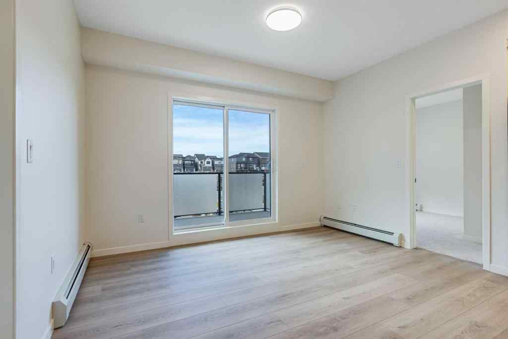 MLS® A2267635 - Unit #207 245 Edith Place NW in Glacier Ridge Calgary, Residential