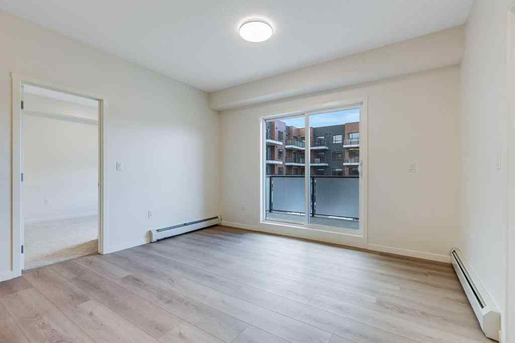 MLS® A2267635 - Unit #207 245 Edith Place NW in Glacier Ridge Calgary, Residential