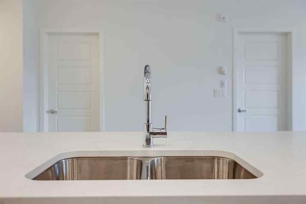 MLS® A2267635 - Unit #207 245 Edith Place NW in Glacier Ridge Calgary, Residential