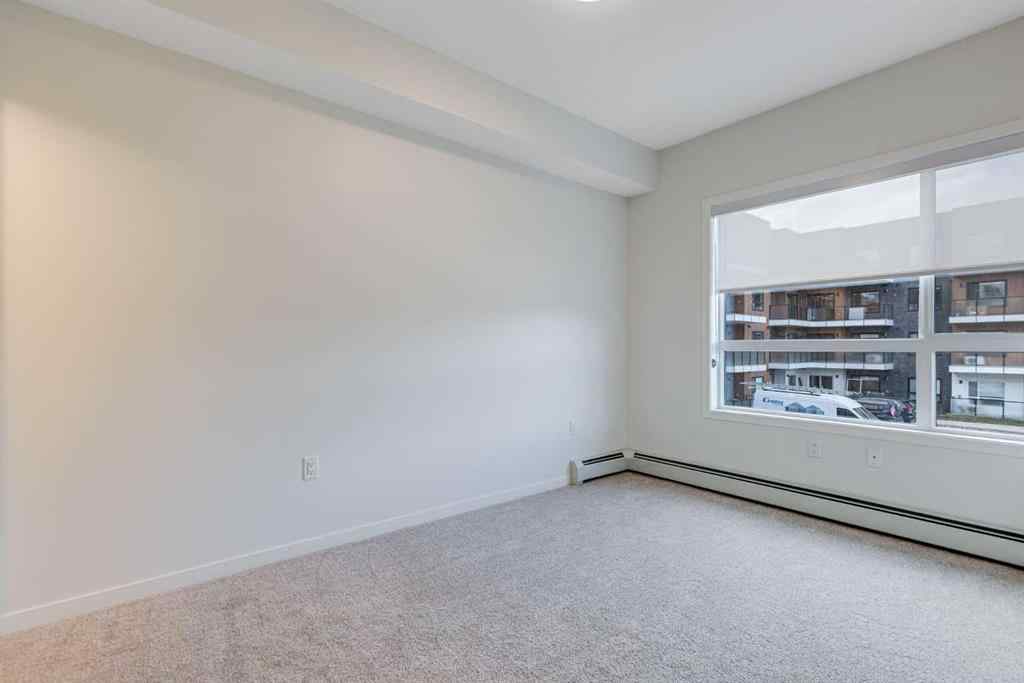 MLS® A2267635 - Unit #207 245 Edith Place NW in Glacier Ridge Calgary, Residential