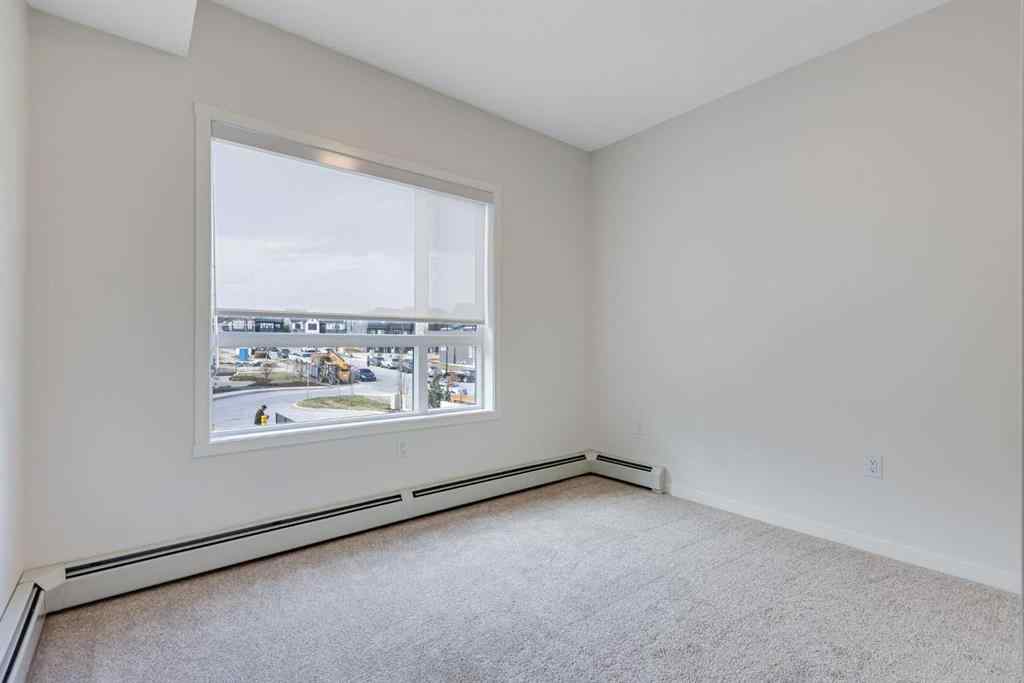 MLS® A2267635 - Unit #207 245 Edith Place NW in Glacier Ridge Calgary, Residential