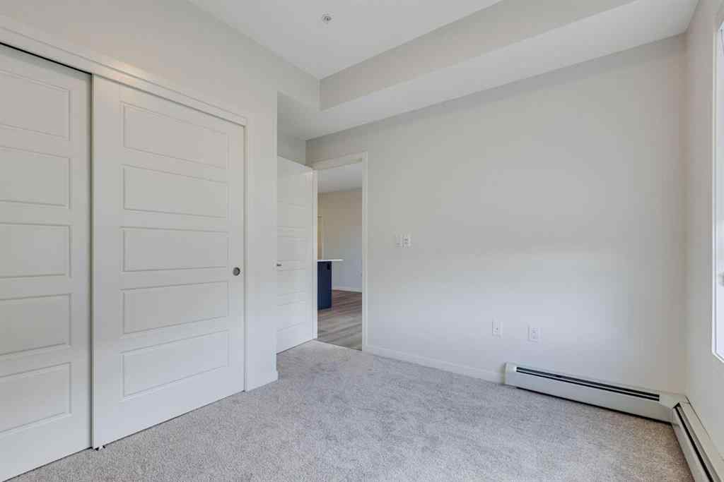 MLS® A2267635 - Unit #207 245 Edith Place NW in Glacier Ridge Calgary, Residential