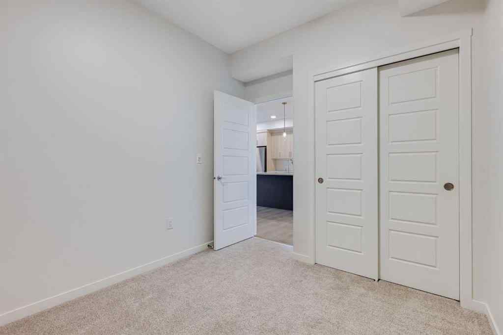 MLS® A2267635 - Unit #207 245 Edith Place NW in Glacier Ridge Calgary, Residential