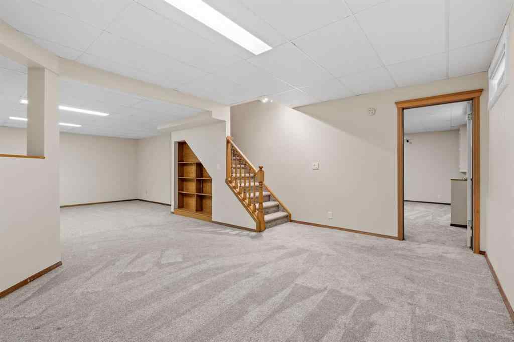 MLS® A2267646 - 667 Macewan Drive NW in MacEwan Glen Calgary, Residential