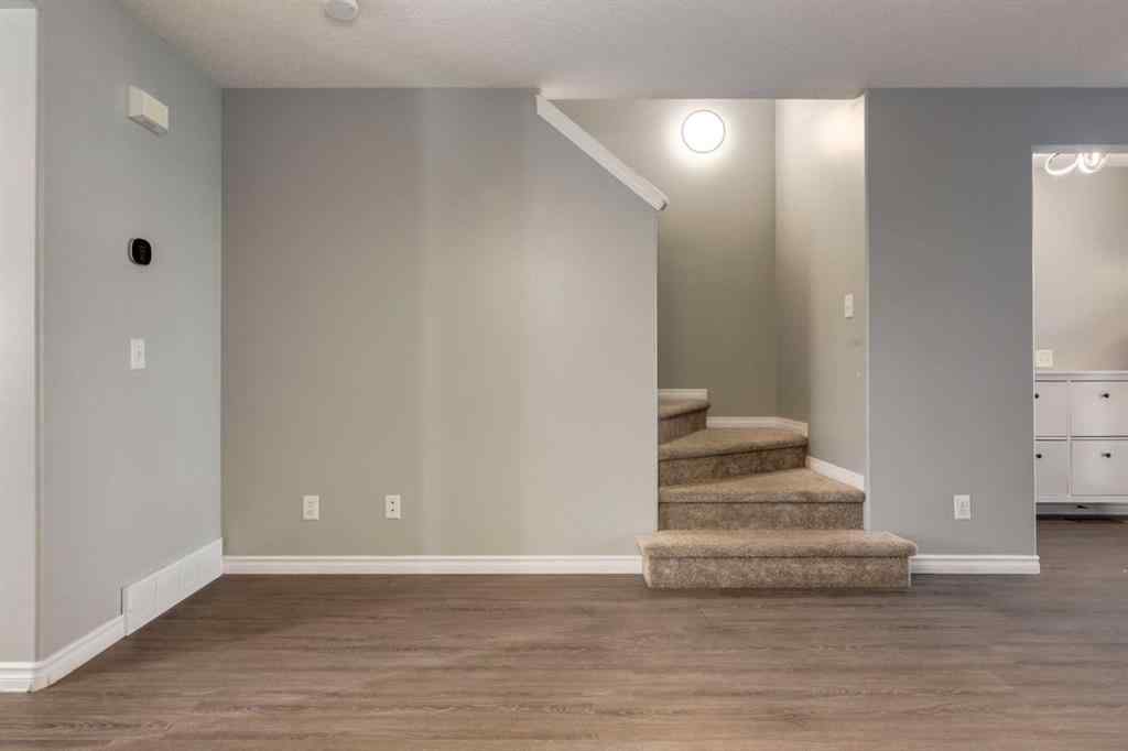 MLS® A2267778 - Unit #5 135 Bow Ridge Drive  in Bow Ridge Cochrane, Residential