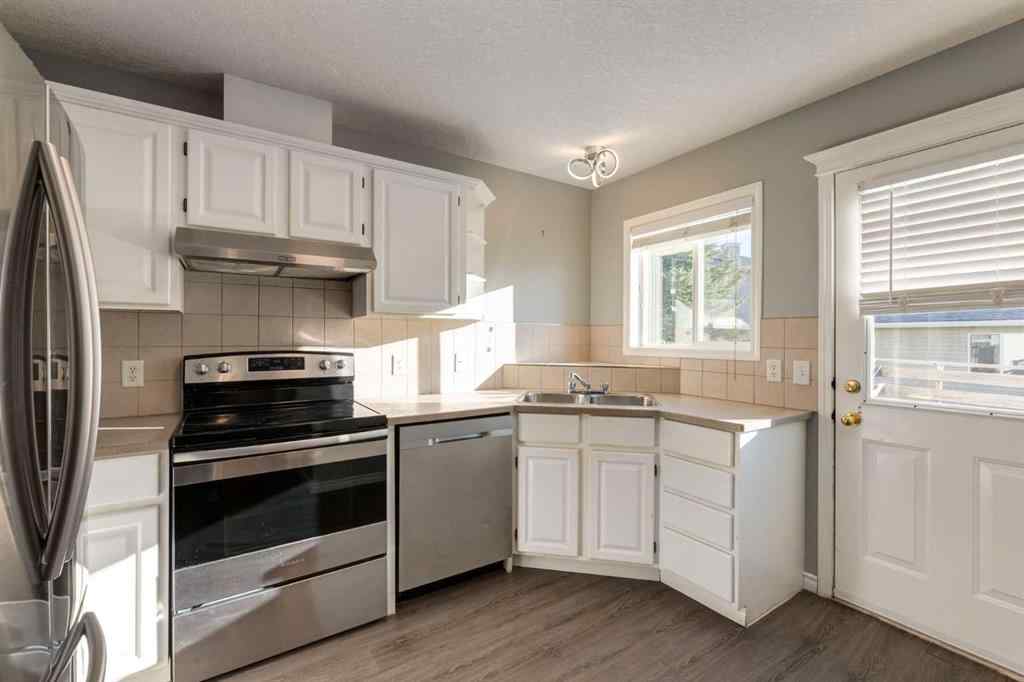 MLS® A2267778 - Unit #5 135 Bow Ridge Drive  in Bow Ridge Cochrane, Residential