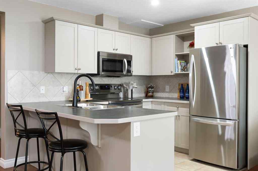 MLS® A2267796 - 90 Cimarron Trail  in Cimarron Okotoks, Residential