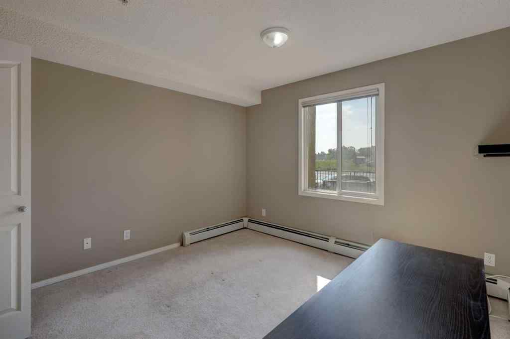 MLS® A2267849 - Unit #8118 304 Mackenzie Way SW in Downtown Airdrie, Residential