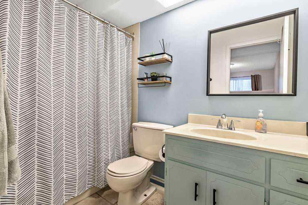 MLS® A2268013 - 106 Woodfield Close SW in Woodbine Calgary, Residential