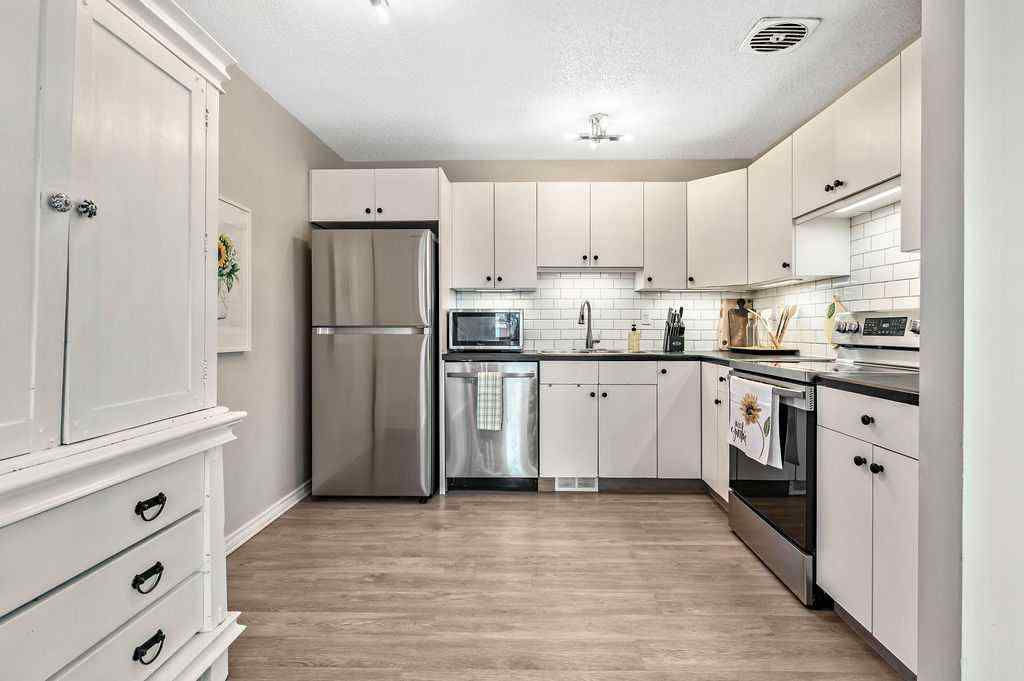 MLS® A2268013 - 106 Woodfield Close SW in Woodbine Calgary, Residential