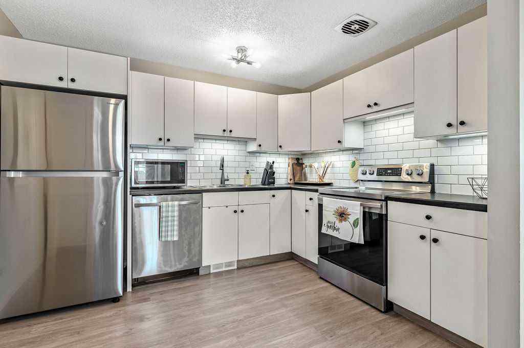 MLS® A2268013 - 106 Woodfield Close SW in Woodbine Calgary, Residential