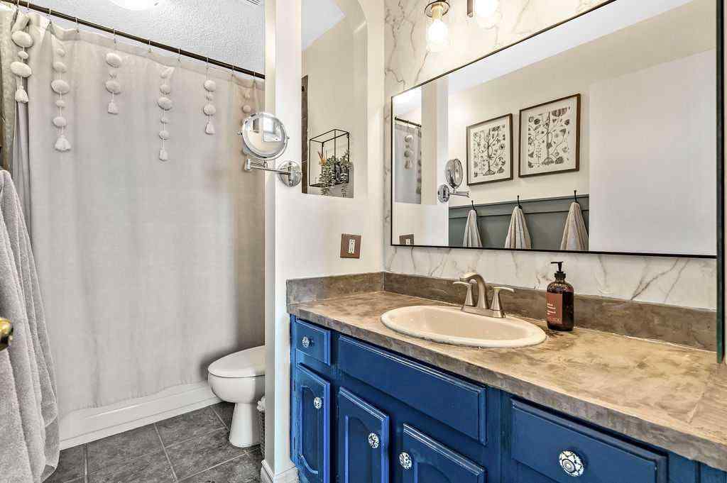 MLS® A2268013 - 106 Woodfield Close SW in Woodbine Calgary, Residential