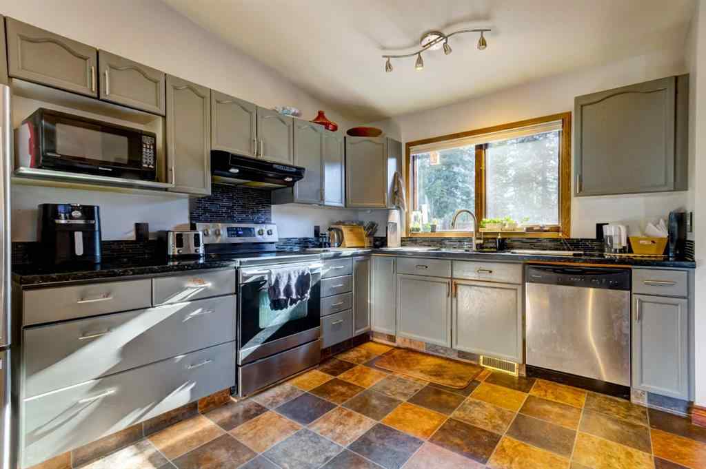MLS® A2268124 - 303 Pioneer Road  in Cougar Creek Canmore, Residential
