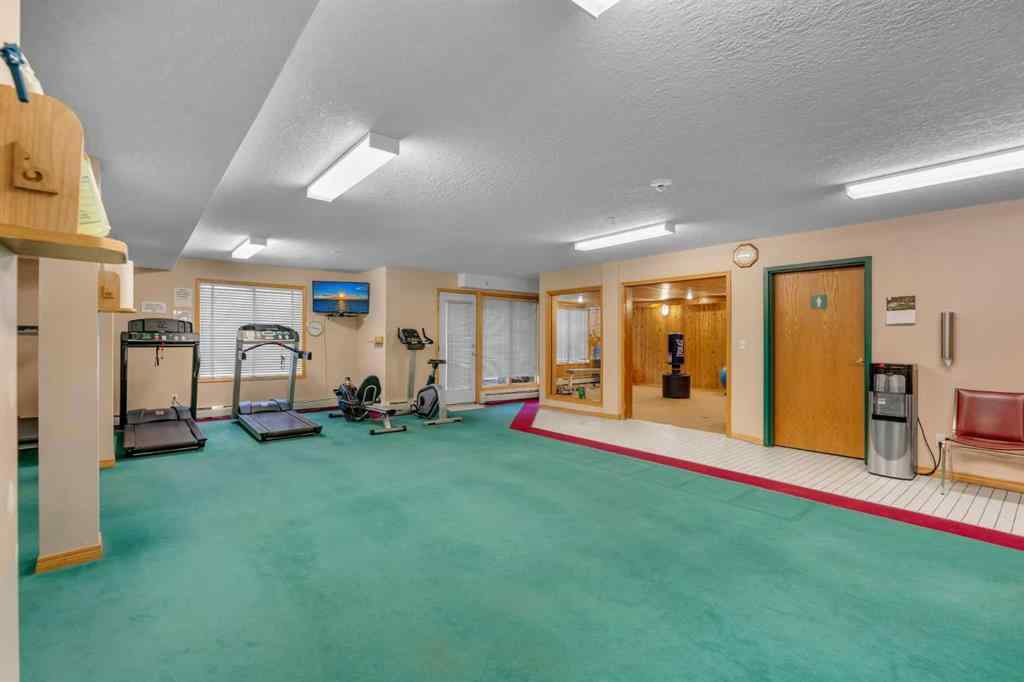 MLS® A2268126 - Unit #122 7229 Sierra Morena Boulevard SW in Signal Hill Calgary, Residential