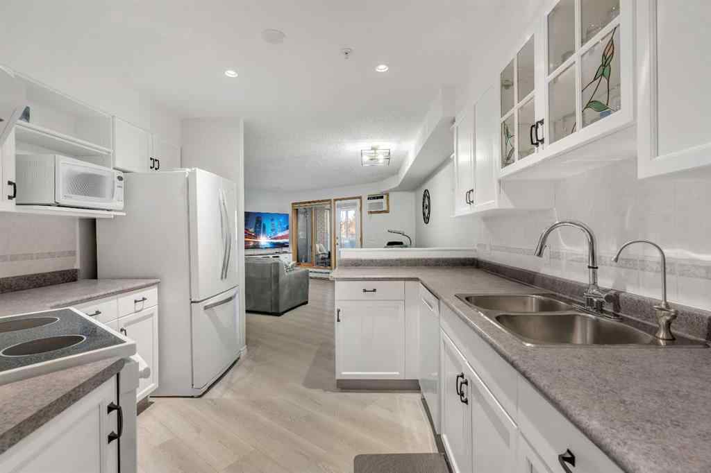 MLS® A2268126 - Unit #122 7229 Sierra Morena Boulevard SW in Signal Hill Calgary, Residential