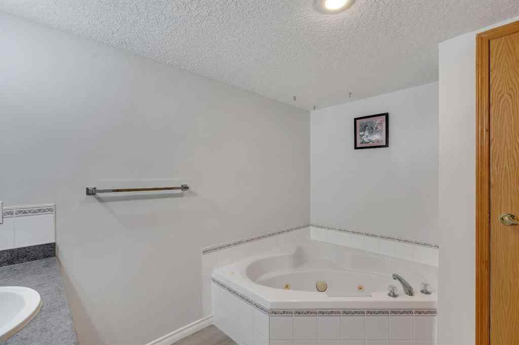 MLS® A2268126 - Unit #122 7229 Sierra Morena Boulevard SW in Signal Hill Calgary, Residential