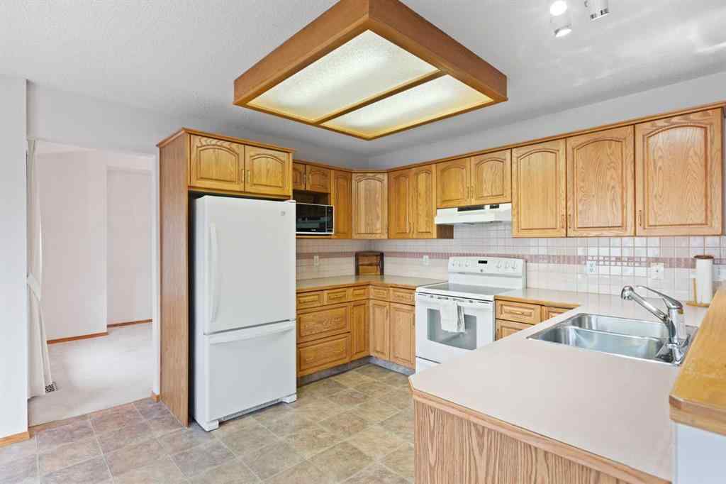 MLS® A2268185 - 97 Downey Road  in Downey Ridge Okotoks, Residential