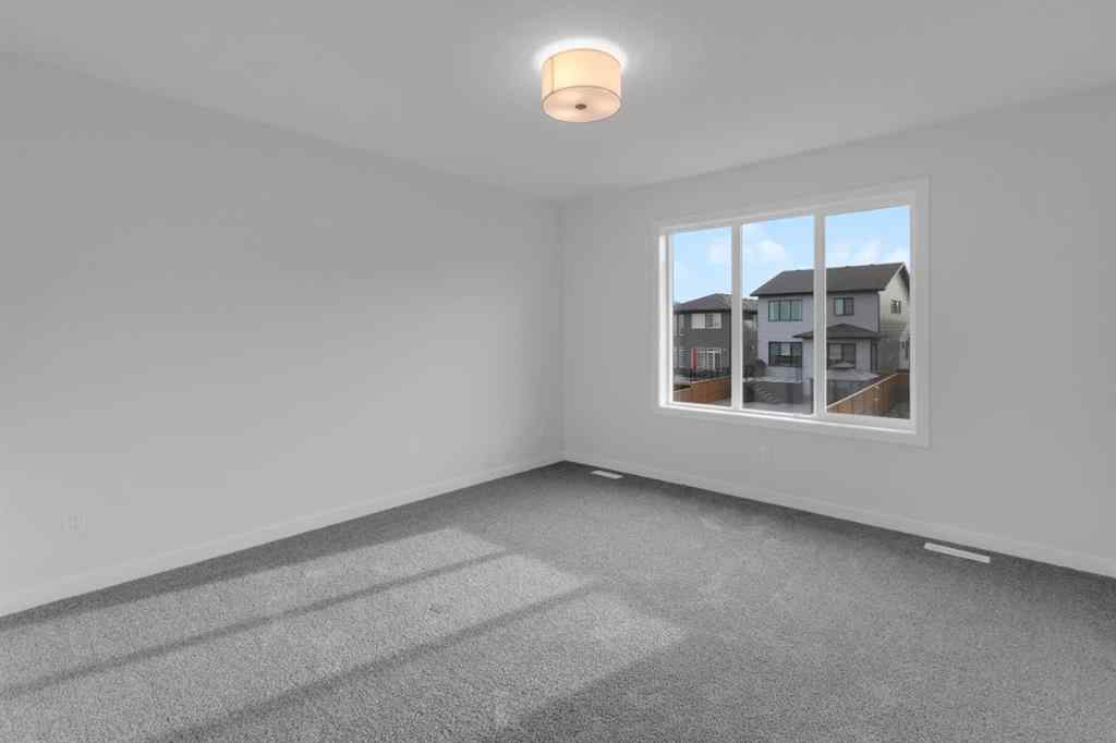 MLS® A2268350 - 303 Calhoun Crescent NE in Livingston Calgary, Residential