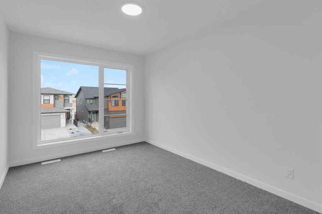 MLS® A2268350 - 303 Calhoun Crescent NE in Livingston Calgary, Residential