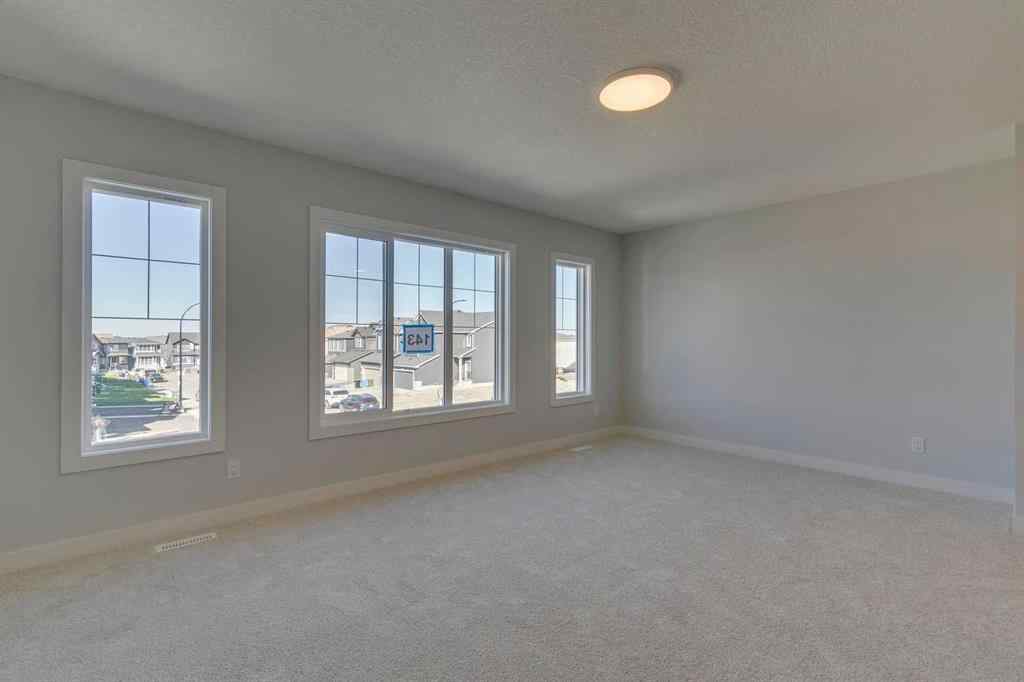 MLS® A2268809 - 143 Creekstone Green SW in Pine Creek Calgary, Residential