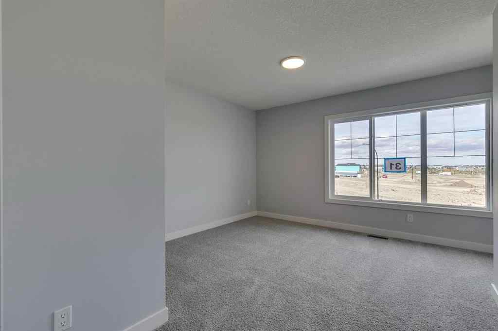 MLS® A2268823 - 31 Creekstone Green SW in Pine Creek Calgary, Residential