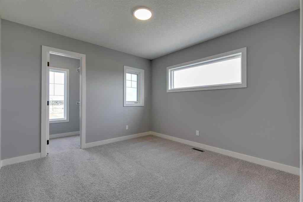 MLS® A2268878 - 23 Creekstone Green SW in Pine Creek Calgary, Residential