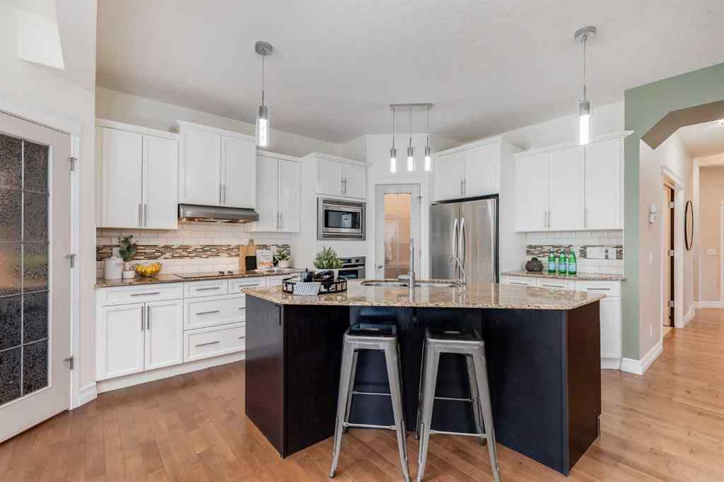 MLS® A2268880 - 1465 Kings Heights Boulevard SE in Kings Heights Airdrie, Residential