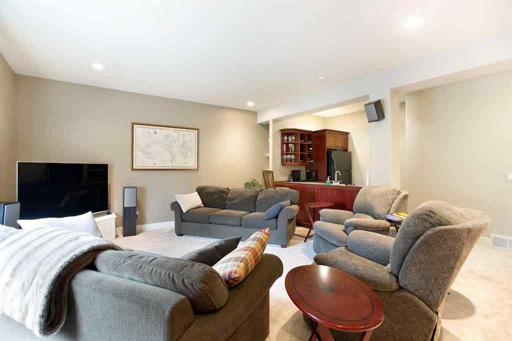 MLS® A2268978 - 311 Rodeo Ridge  in Springbank Links Rural Rocky View County, Residential