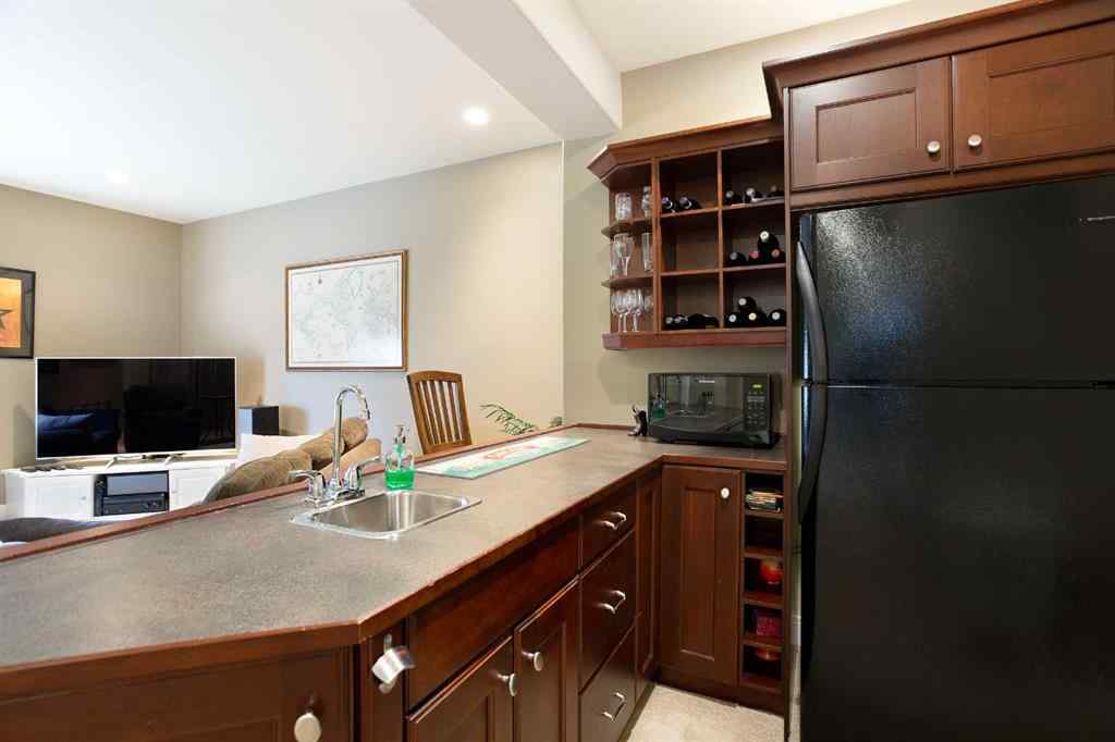 MLS® A2268978 - 311 Rodeo Ridge  in Springbank Links Rural Rocky View County, Residential