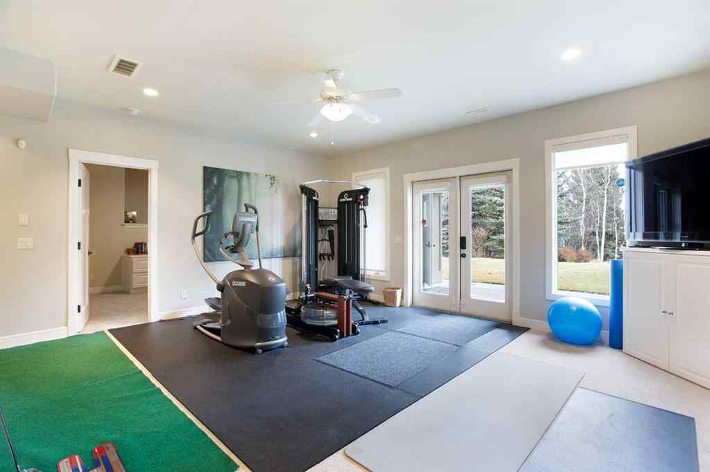 MLS® A2268978 - 311 Rodeo Ridge  in Springbank Links Rural Rocky View County, Residential