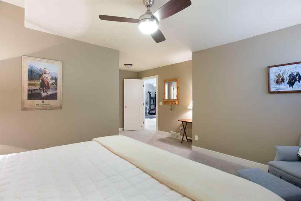 MLS® A2268978 - 311 Rodeo Ridge  in Springbank Links Rural Rocky View County, Residential