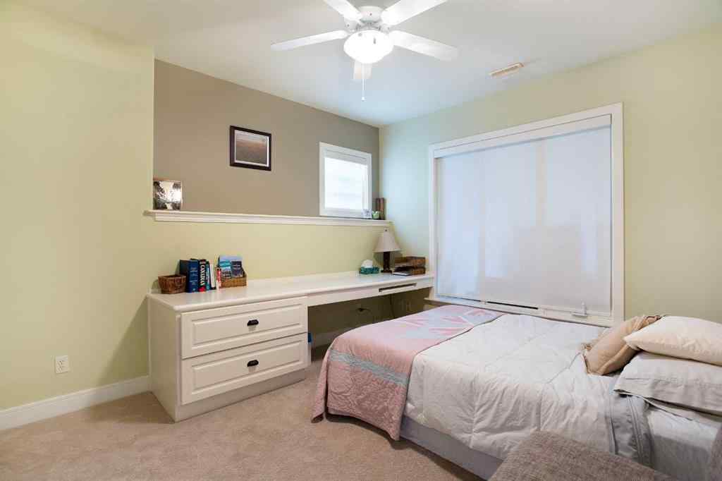 MLS® A2268978 - 311 Rodeo Ridge  in Springbank Links Rural Rocky View County, Residential