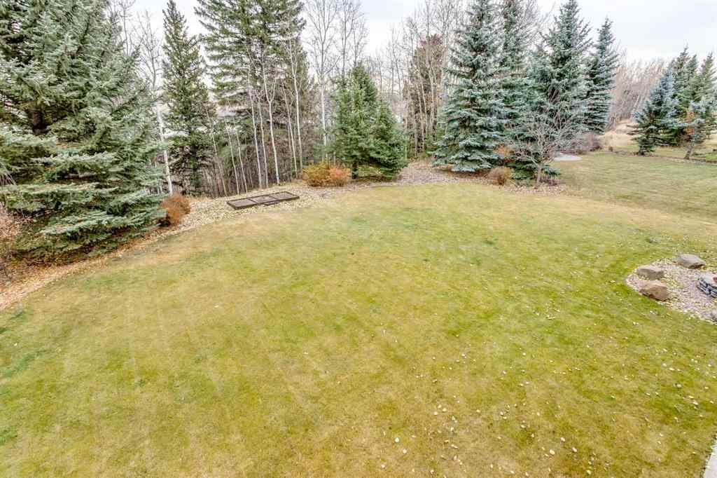 MLS® A2268978 - 311 Rodeo Ridge  in Springbank Links Rural Rocky View County, Residential