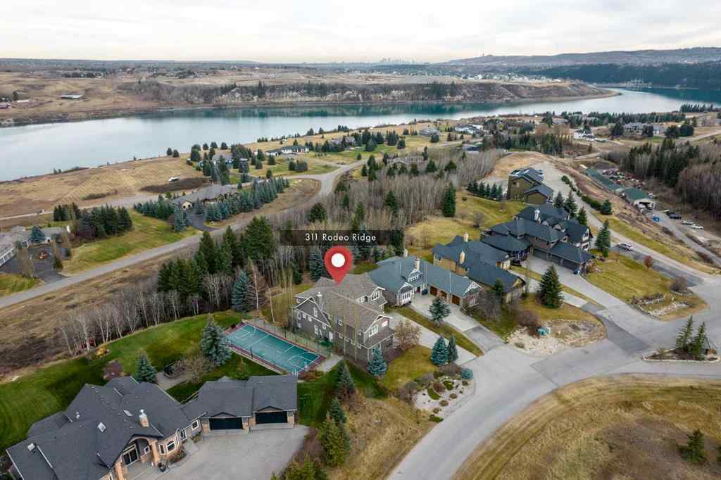 MLS® A2268978 - 311 Rodeo Ridge  in Springbank Links Rural Rocky View County, Residential