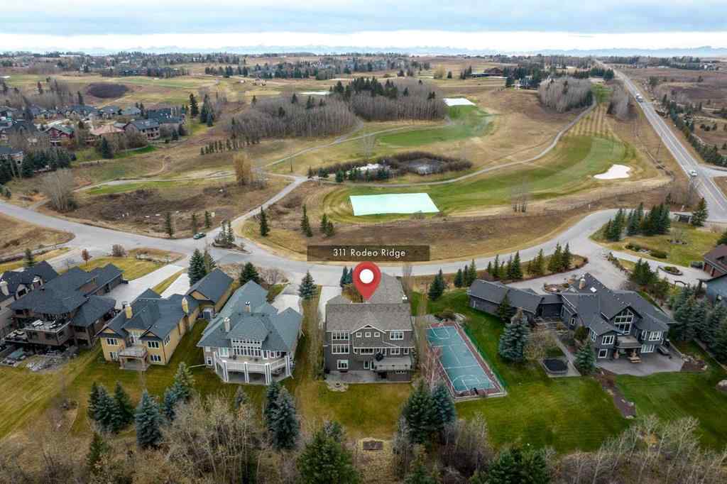 MLS® A2268978 - 311 Rodeo Ridge  in Springbank Links Rural Rocky View County, Residential