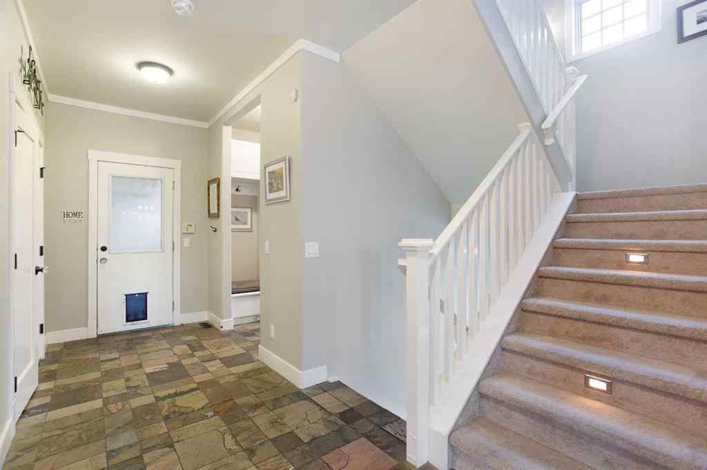 MLS® A2268978 - 311 Rodeo Ridge  in Springbank Links Rural Rocky View County, Residential