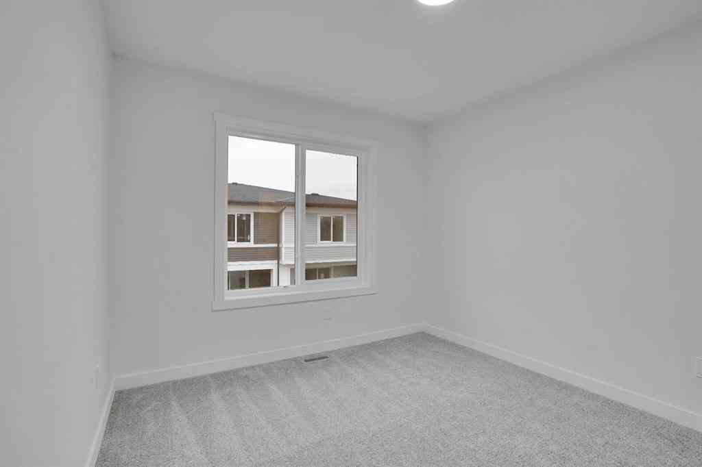 MLS® A2269005 - 186 Belmont Street SW in Belmont Calgary, Residential